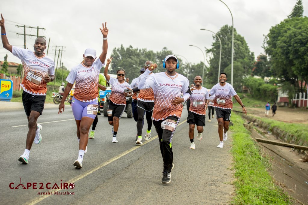 YFtz-391 Cape To Cairo Marathon, A unique Pan-African marathon experience organized by Adhama Adventures. Runners from across Africa gather in the heart of Arusha for a celebration of unity, culture, and sport. Distances: 5km, 10km, 21km, 42km